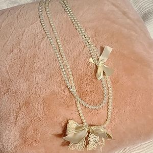 pearl necklace with bow